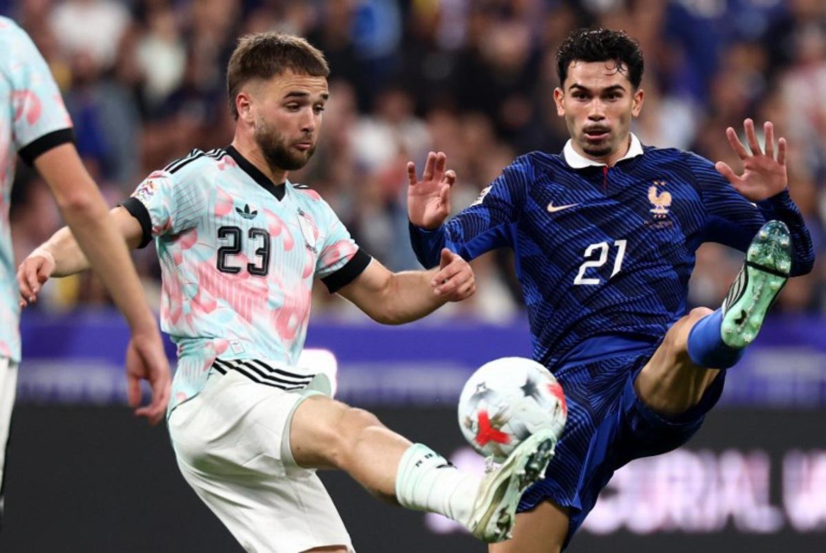 France's midfielder #21 Lucas Da Cunha (R) and Belgium's midfielder #23 Nicolas Raskin fight for the ball during the UEFA Nations League Group A1 football match between France and Belgium at the Stade de France in Saint-Denis, north of Paris, on October 5, 2026. FRANCK FIFE / AFP