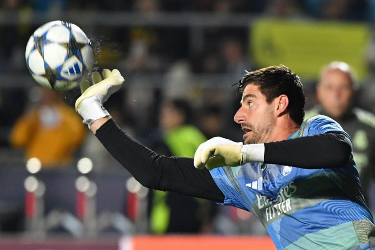 Real Madrid's Belgian goalkeeper #01 Thibaut Courtois warms up prior to the UEFA Champions League first round day 2 football match between Real Madrid and Kairat Almaty at the Almaty Ortalyk stadion in Almaty on September 30, 2025. Vyacheslav OSELEDKO / AFP