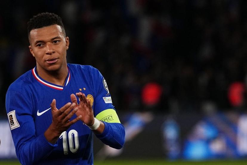 France's forward #10 Kylian Mbappe applauds at the end of the 2026 World Cup qualifiers Europe zone group D football match between France and Ukraine at the Parc des Princes stadium in Paris, on November 13, 2025. France wins 4 - 0 against Ukraine and qualifies foe the 2026 World Cup. Dimitar DILKOFF / AFP