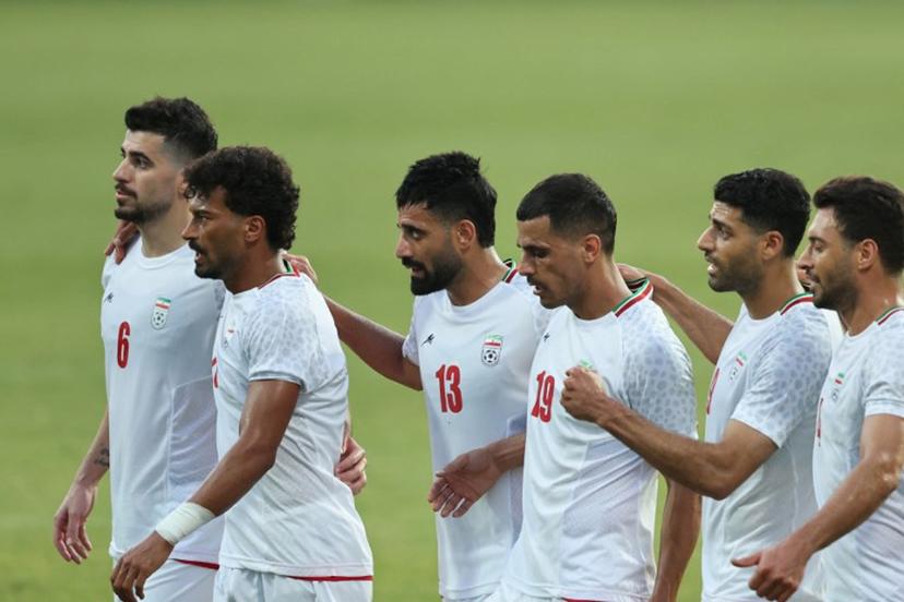 Iran's Forward #23 Ramin Rezaeian celebrates with teammates after scoring their side's second goal during an international friendly football match between Iran and Gambia, in Antalya, southern Turkey, May 29, 2026, as part of Iran's preparation for the upcoming football World Cup. Oner SAN / AFP
