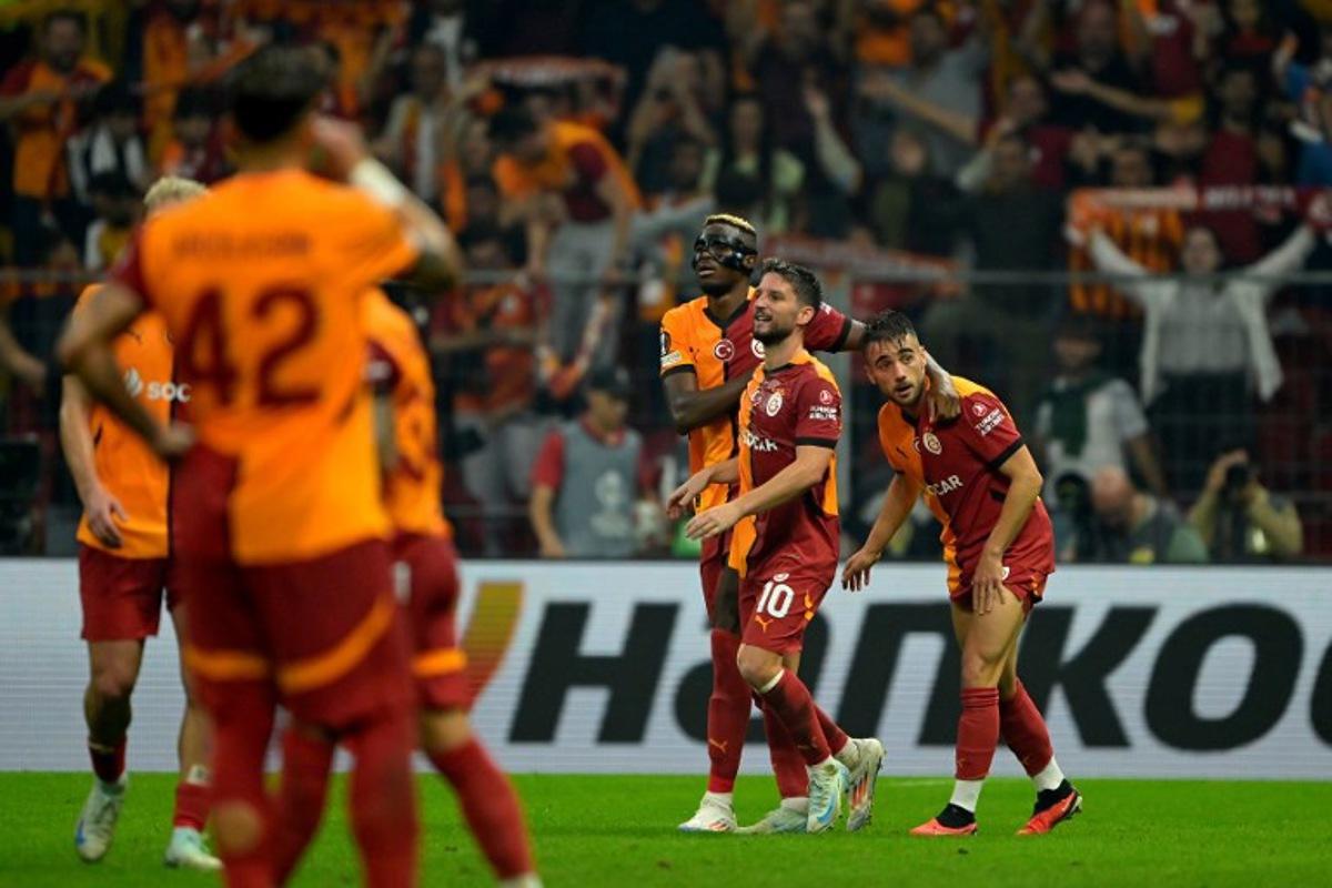 Galatasaray's Turkish forward #11 Yunus Akgun (R) celebrates scoring his team's second goal with Glatasaray's Belgian forward #10 Dries Mertens (2nd-R) and Galatasaray's Nigerian forward #45 Victor Osimhen (C) during the UEFA Europa League 1st round day 1 football match between Galatasaray SK and PAOK FC at the Ali Sami Yen Sports Complex in Sisli, near Istanbul, on September 25, 2024. Yasin AKGUL / AFP