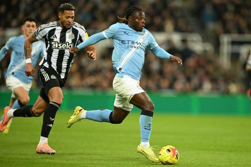 Manchester City's Belgian midfielder #11 Jeremy Doku runs with the ball during the English Premier League football match between Newcastle United and Manchester City at St James' Park in Newcastle-upon-Tyne, north east England on November 22, 2025. Oli SCARFF / AFP