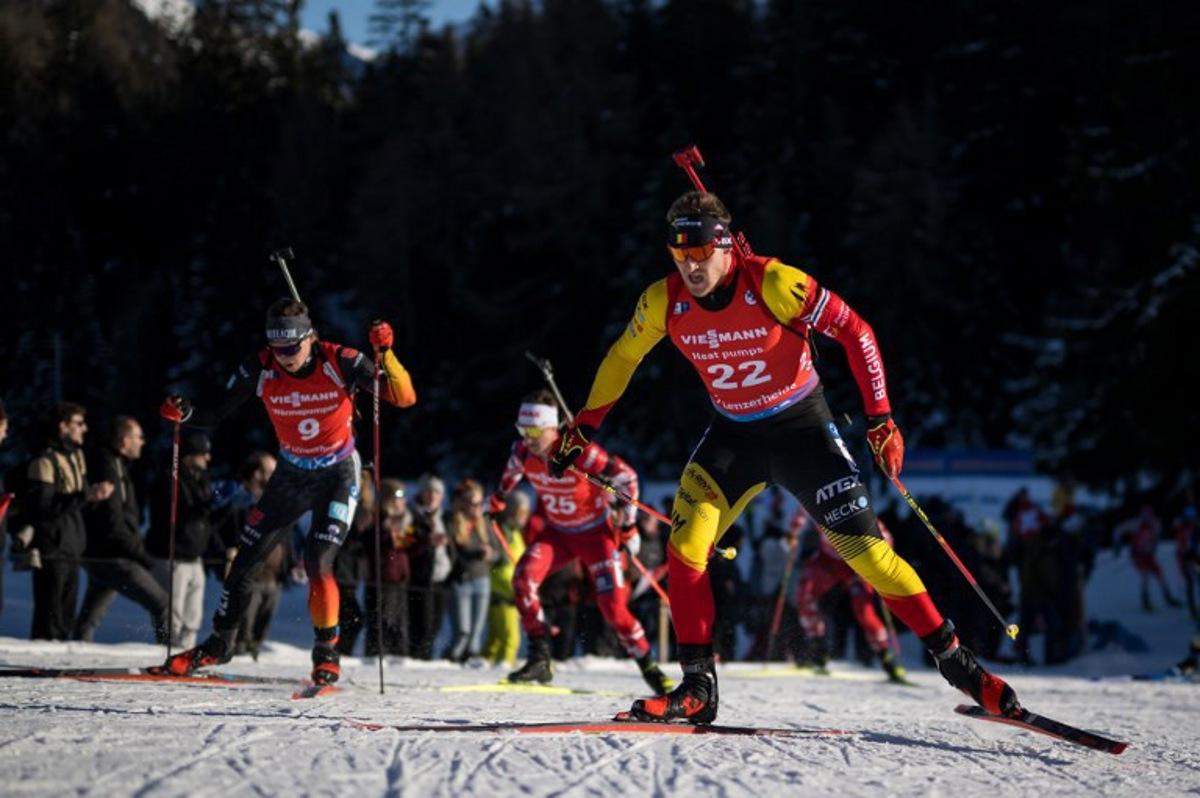Belgium Florent Claude #22 competes in the Men's 15 km Mass Start competition during the IBU Biathlon World Cup in Lenzerheide, Switzerland, on December 17, 2023. Fabrice COFFRINI / AFP