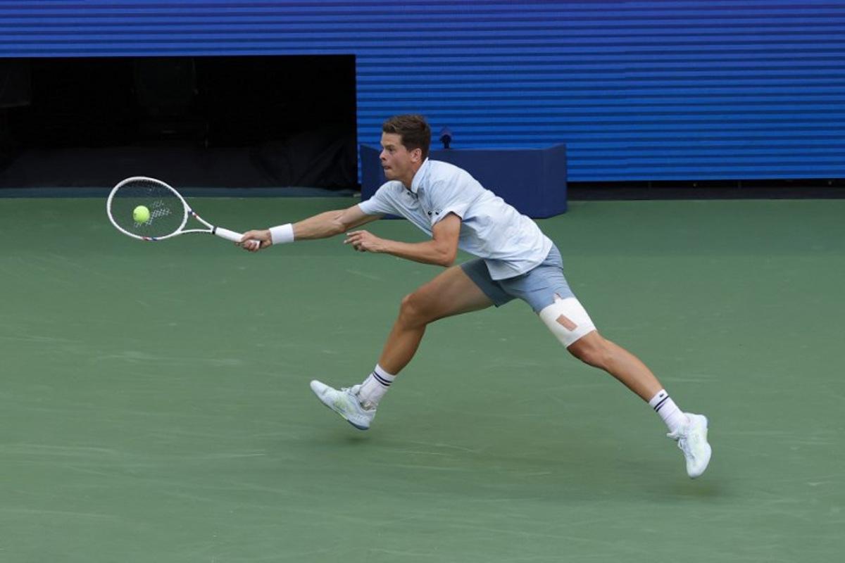 Belgium's Alexander Blockx hits a return to Argentina's Francisco Cerundolo in their men's singles round of 16 tennis match on day nine of the US Open tennis tournament at the USTA Billie Jean King National Tennis Center in New York on September 7, 2026. KENA BETANCUR / AFP