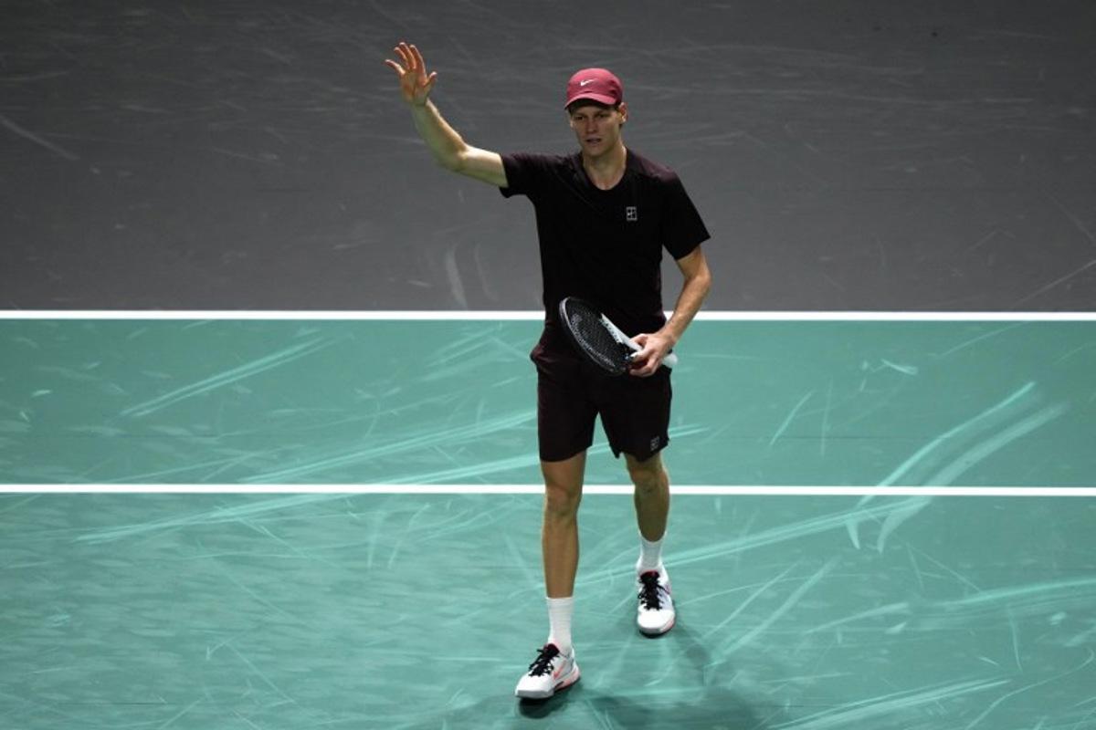 Italy's Jannik Sinner celebrates after winning against US Ben Shelton at the end of their men's singles quarter-final match on day five of the Paris ATP Masters 1000 tennis tournament at the Paris La Défense Arena in Nanterre, on the outskirts of Paris, on October 31, 2025. Dimitar DILKOFF / AFP