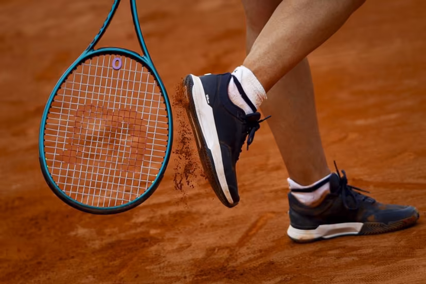 France's Leolia Jeanjean taps her shoe with her racket during her women's singles match against Romania's Elena Ruxandra Bertea at the Billie Jean King Cup play-offs between France and Romania, at Oeiras on the outskirts of Lisbon, on April 9, 2026. FILIPE AMORIM / AFP