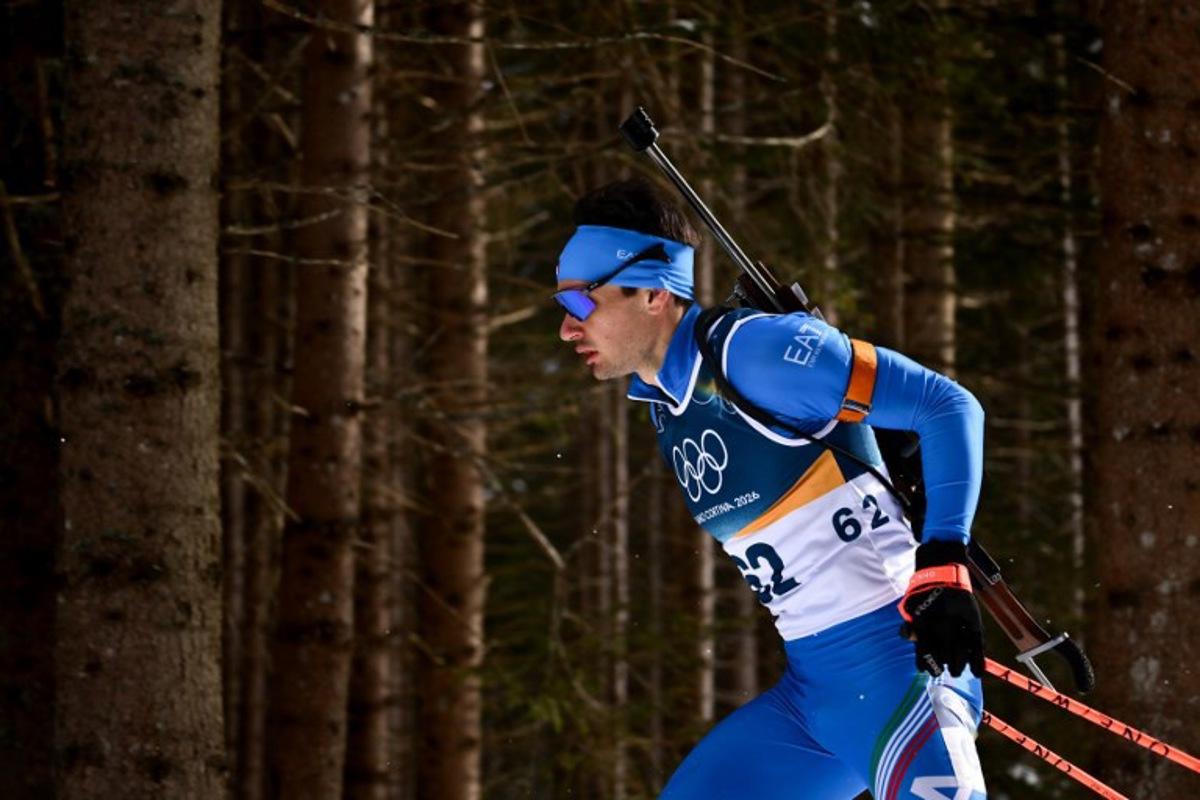 Italy's Tommaso Giacomel competes in the men's biathlon 10km sprint event during the Milano Cortina 2026 Winter Olympic Games at the Anterselva Biathlon Arena (Sudtirol Arena) in Anterselva (Val Pusteria) on February 13, 2026. Marco BERTORELLO / AFP