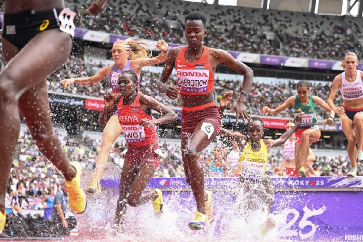 Athletes including Kenya's athlete Faith Cherotich (C) compete in the women's 3000m steeplechase heats during the World Athletics Championships in Tokyo on September 15, 2025. Kirill KUDRYAVTSEV / AFP