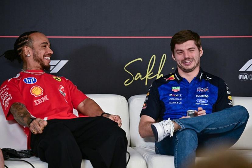 Ferrari's British driver Lewis Hamilton (L) and Red Bull Racing's Dutch driver Max Verstappen attend a press conference on the first day of the second Formula One pre-season test at the Bahrain International Circuit in Sakhir on February 18, 2026. Giuseppe CACACE / AFP