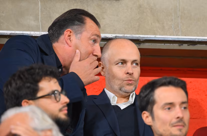 Standard's sport director Marc Wilmots, Ceo Standard's Giacomo Angelini and talk during a soccer match between Standard de Liege and KV Mechelen, Friday 12 September 2025 in Liege, on day 7 of the 2025-2026 'Jupiler Pro League' first division of the Belgian championship. BELGA PHOTO JOHN THYS