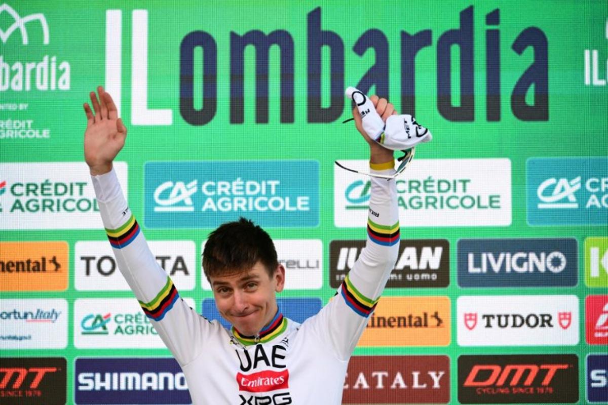 UAE Team Emirates's Slovenian rider Tadej Pogacar celebrates his victory on the podium after the 119th edition of the Giro di Lombardia (Tour of Lombardy), a 238km cycling race from Como to Bergamo on October 11, 2025. Marco BERTORELLO / AFP
