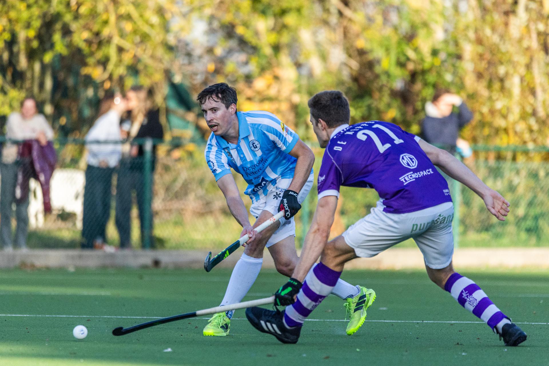 Gantoise's Sean Murray and Beerschot¿s Archibald De Kepper pictured in action during a hockey game between Beerschot and Gantoise, Sunday 09 November 2025 in Boussu, on day 10 of the Belgian first division hockey championship. BELGA PHOTO PAULINE SCHUMACKER