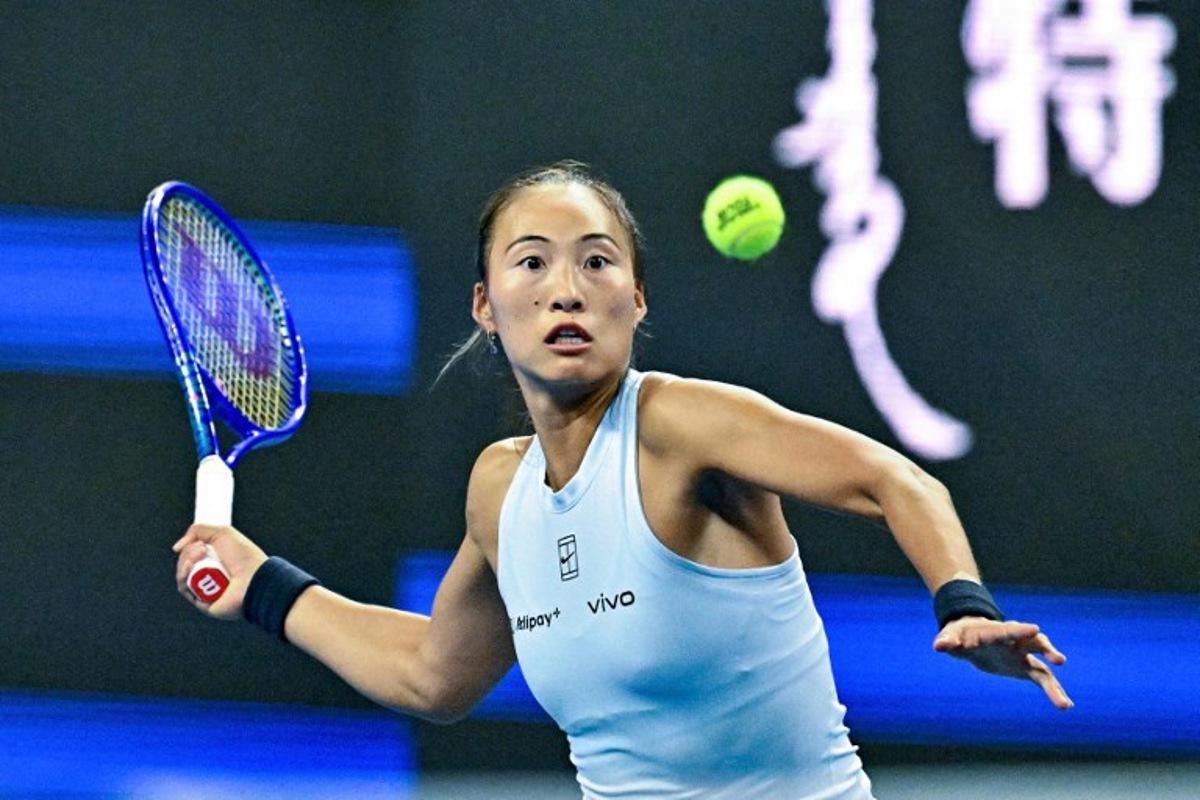China's Zheng Qinwen hits a return to Czech Republic's Linda Noskova during their women's singles match at the China Open tennis tournament in Beijing on September 29, 2025. Pedro PARDO / AFP