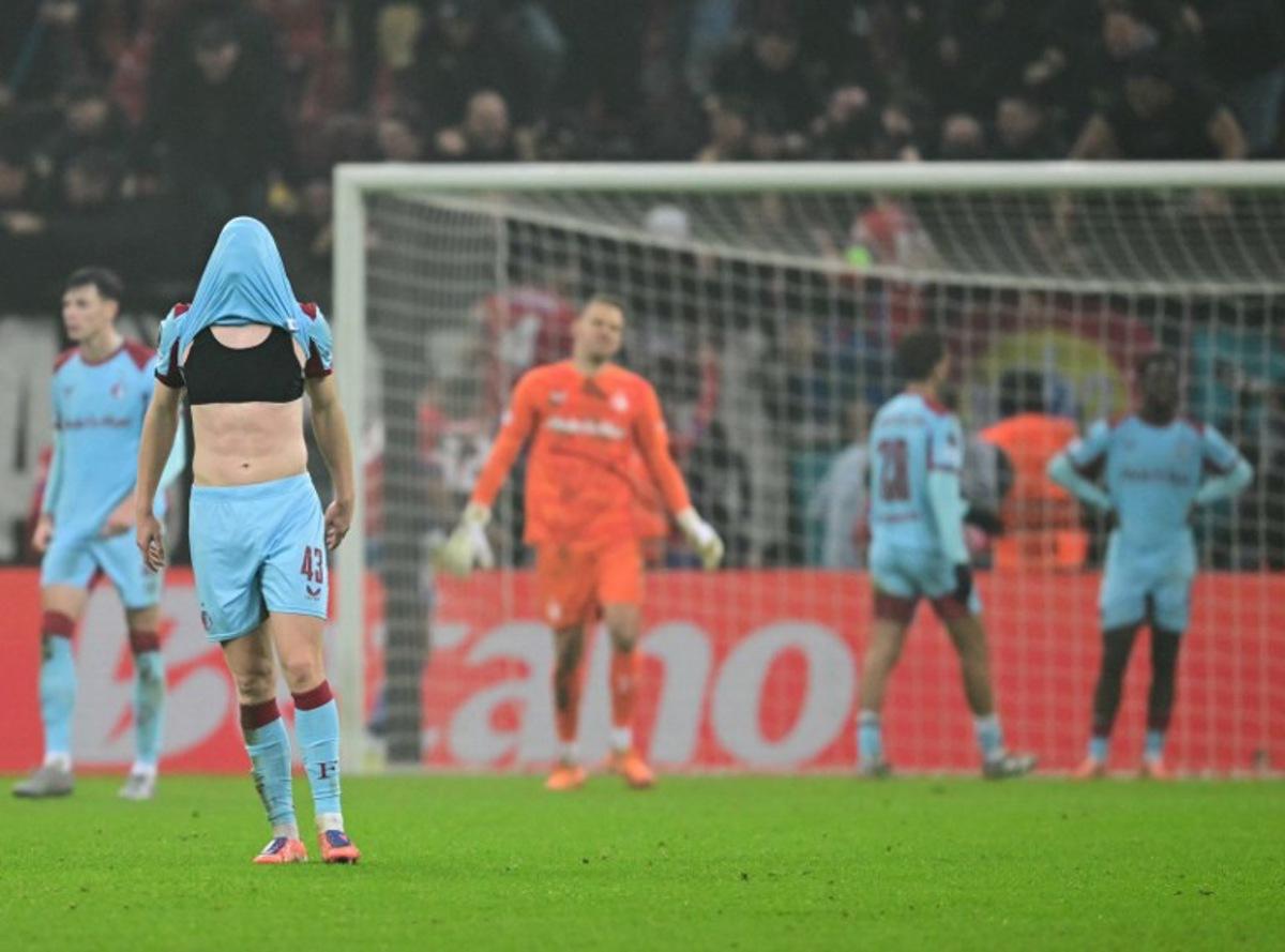 Feyenoord's Dutch defender #43 Jan Plug (L) reacts to the 4-3 during the UEFA Europa League first round - day 6 football match between FCSB Bucharest and Feyenoord in Bucharest, Romania, on December 11, 2025. Daniel MIHAILESCU / AFP