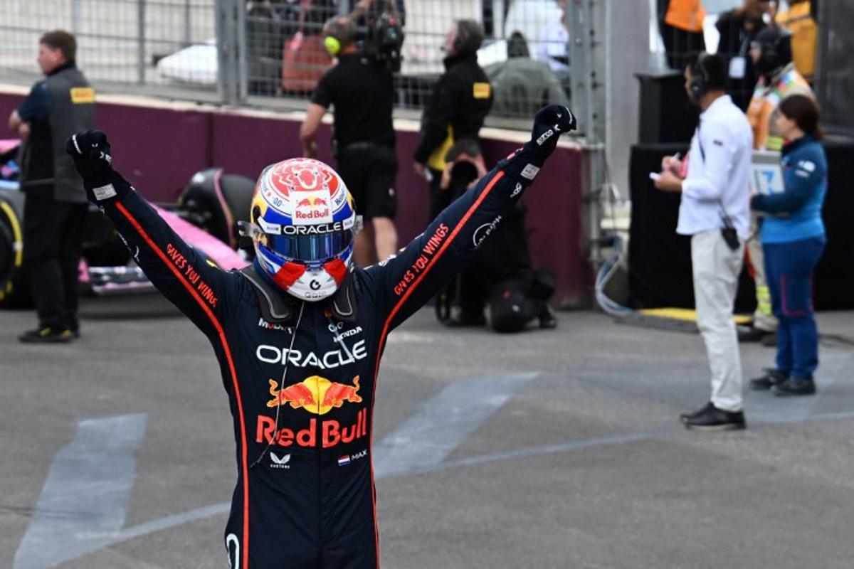 Red Bull Racing's Dutch driver Max Verstappen celebrates in the parc ferme after winning the Formula One Azerbaijan Grand Prix at the Baku City Circuit in Baku on September 21, 2025. Ozan KOSE / AFP