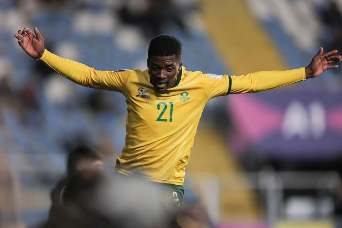 South Africa's forward #21 Siviwe Magidigidi celebrates scoring his team's fourth goal during the 2025 FIFA U-20 World Cup football match between South Africa and New Caledonia at El Teniente Stadium in Rancagua, Chile on October 2, 2025. Javier TORRES / AFP
