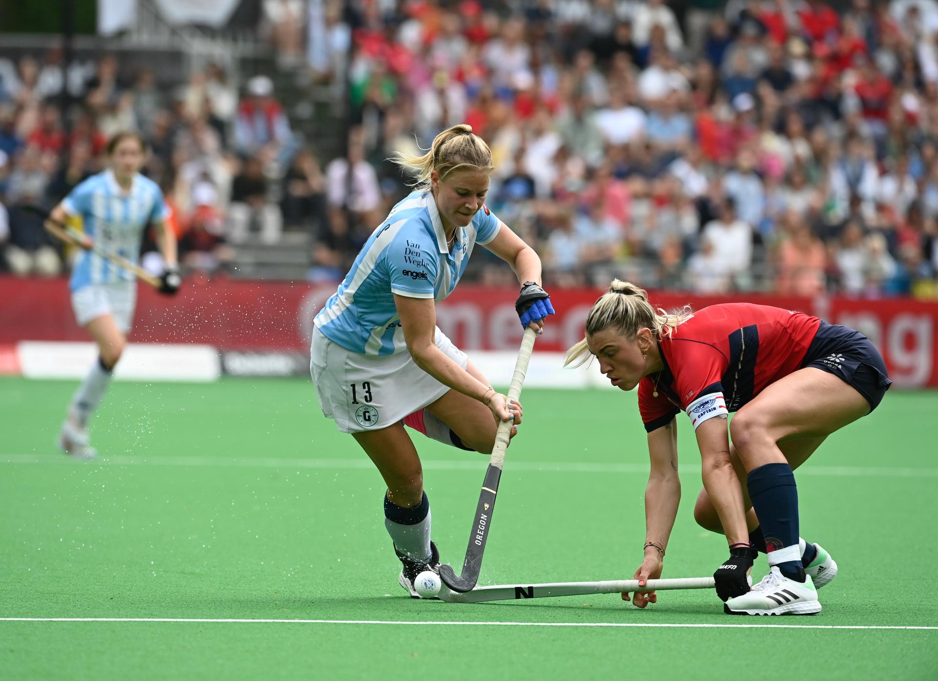 Gantoise's Alix Gerniers and Dragons' Valerie Magis fight for the ball during a hockey game between KHC Dragons and Gantoise, Sunday 21 May 2023 in Brasschaat, the second leg of the finals in the play-offs for the Belgian Women Hockey League season 2022-2023. BELGA PHOTO JOHN THYS