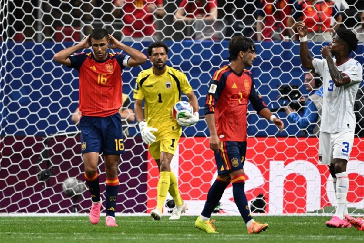 Spain's midfielder #16 Rodri (L) reacts after next to Cape Verde's goalkeeper #01 Vozinha (C) after missing a goal opportunity during the 2026 World Cup Group H football match between Spain and Cape Verde at the Atlanta Stadium in Atlanta on June 15, 2026. Roberto SCHMIDT / AFP