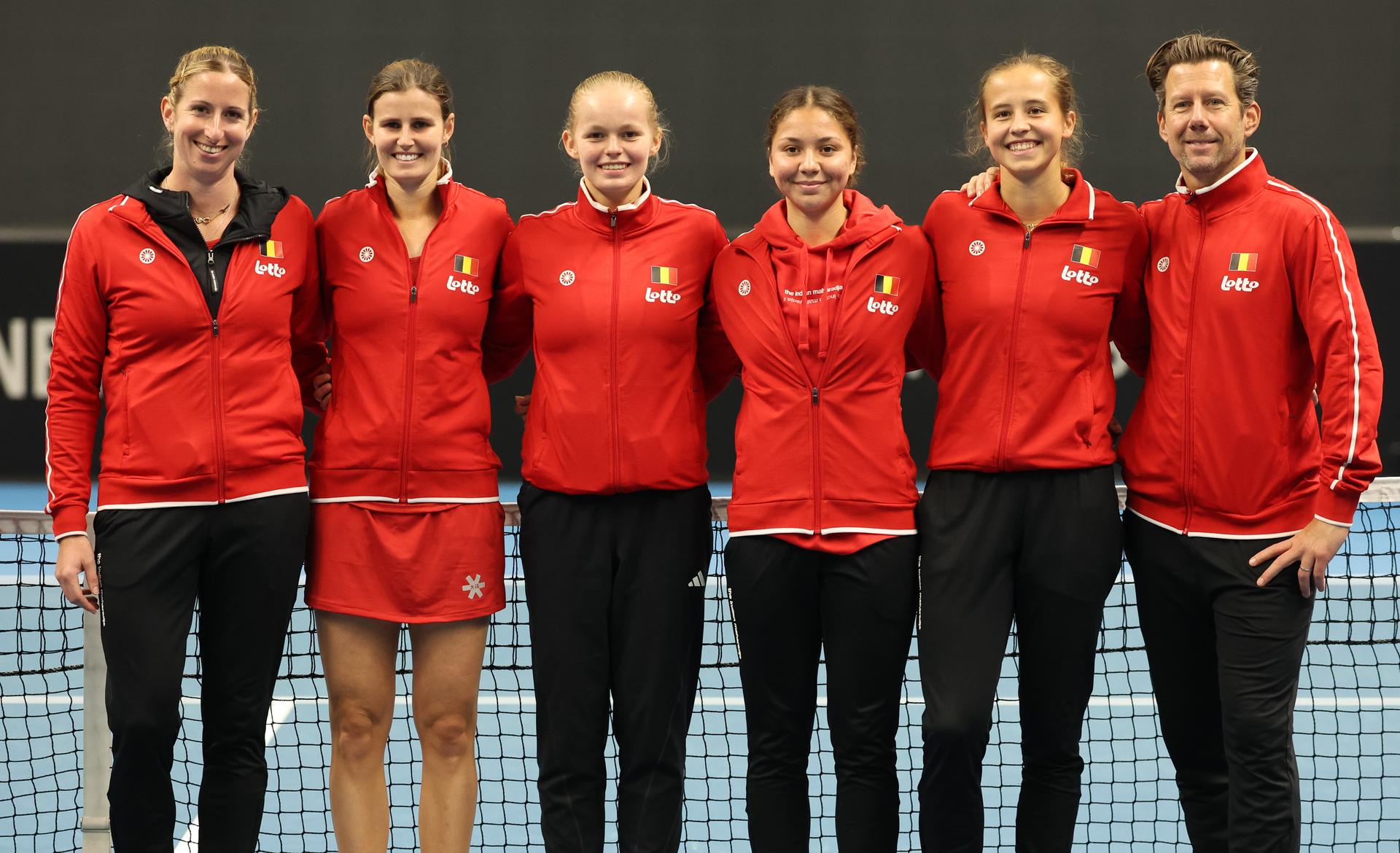 Belgian Magali Kempen, Belgian Greet Minnen, Belgian Jeline Vandromme, Belgian Sofia Costoulas, Belgian Hanne Vandewinkel and Belgian team captain Wim Fissette pose for the photographer at the medal ceremony after the Promotion Play-offs between Belgium and France in the Europe/Africa Group I of the Billie Jean King Cup tennis, on Friday 11 April 2025 in Vilnius, Lithuania. PHOTO VIRGINIE LEFOUR