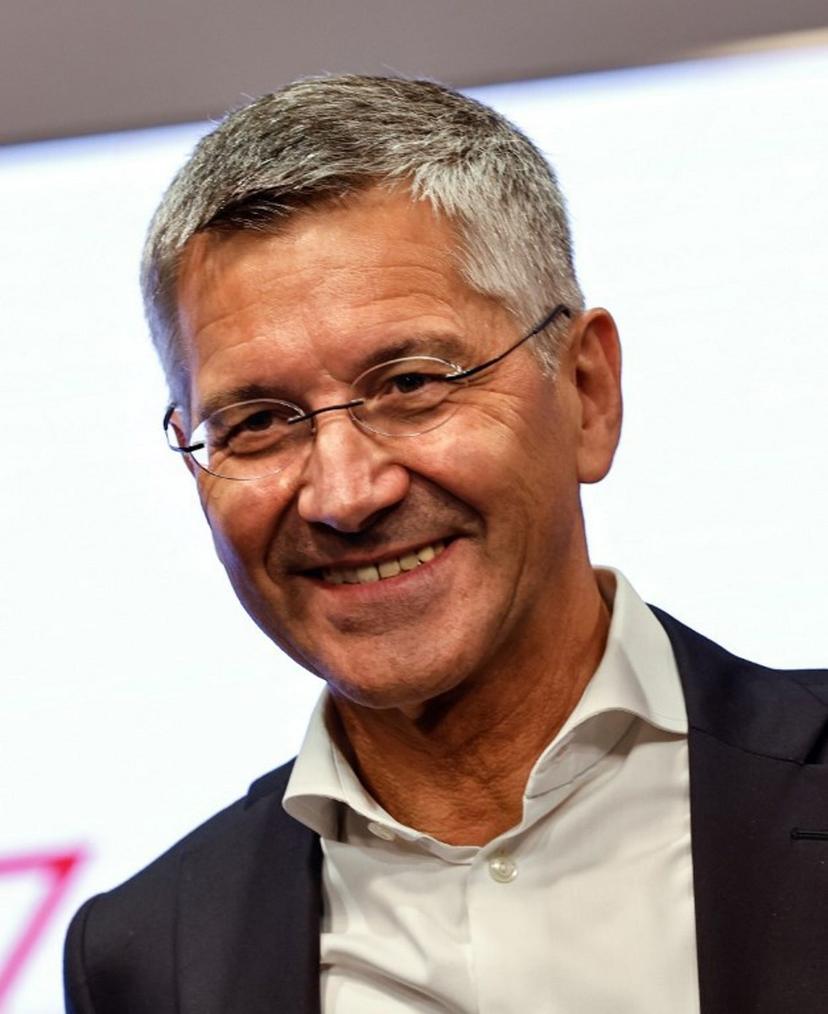 Bayern Munich's President Herbert Hainer smiles during the presentation by German football club FC Bayern Munich of an exhibition about their stadium called "20 Years of Allianz Arena - Castle in the Air, Living Room, Opera Stage", on July 30, 2025 on the stadium compound in Munich. Alexandra BEIER / AFP
