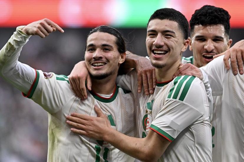 Algeria's midfielder #22 Ibrahim Maza (C) celebrates scoring his team's third goal with Algeria's forward #11 Anis Hadj Moussa during the Africa Cup of Nations (CAN) Group E football match between Equatorial Guinea and Algeria at Moulay Hassan Stadium in Rabat on December 31, 2025. Gabriel BOUYS / AFP