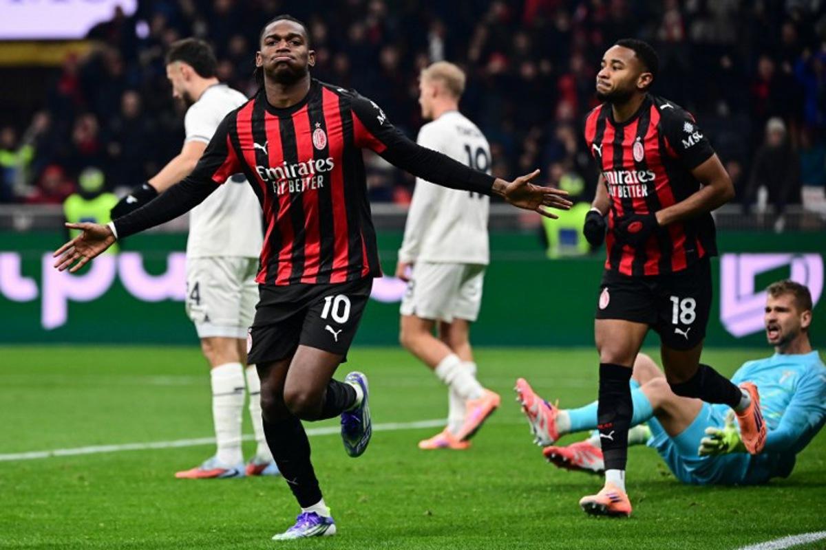AC Milan's Portuguese forward #10 Rafael Leao (C) celebrates scoring his team's first goal during the Italian Serie A football match between AC Milan and Lazio at the San Siro stadium in Milan on November 29, 2025. Piero CRUCIATTI / AFP