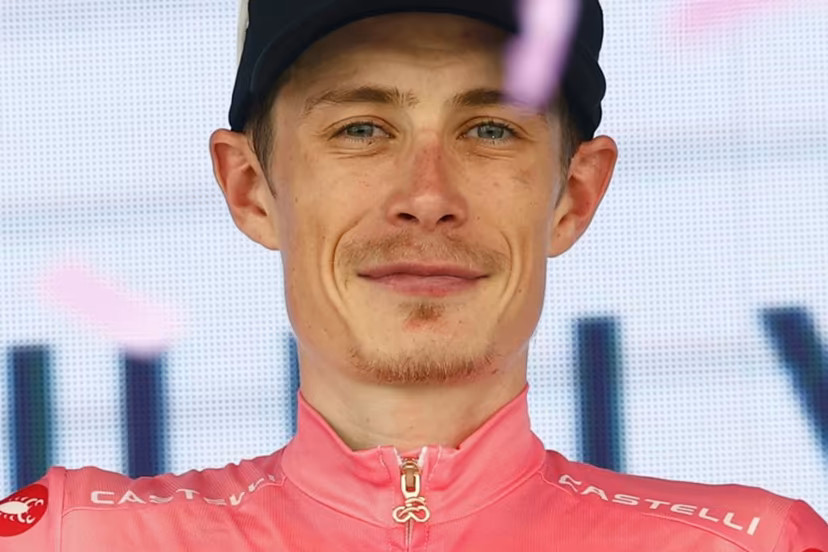 Team Visma Lease a Bike Danish rider Jonas Vingegaard celebrates the overall leader's pink jersey on the podium of the 15th stage of the Giro d'Italia 2026 - Tour of Italy cycling race between Voghera and Milan, Italy, on May 24, 2026. Luca Bettini / AFP