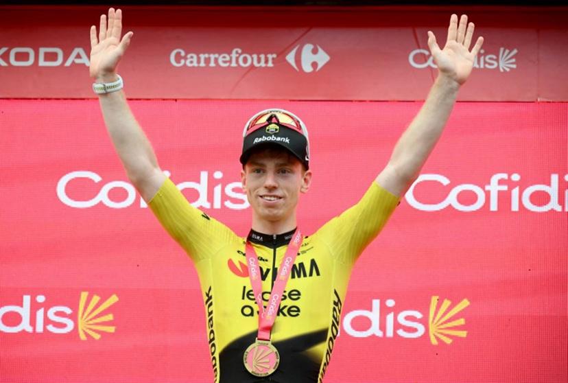 Team Visma-Lease a bike's British rider Matthew Brennan celebrates on the podium after winning the 11th stage of the Vuelta a Espana 2026 cycling tour, a 151,3 km race between Carthagena and Lorca, on September 2, 2026. JOSE JORDAN / AFP