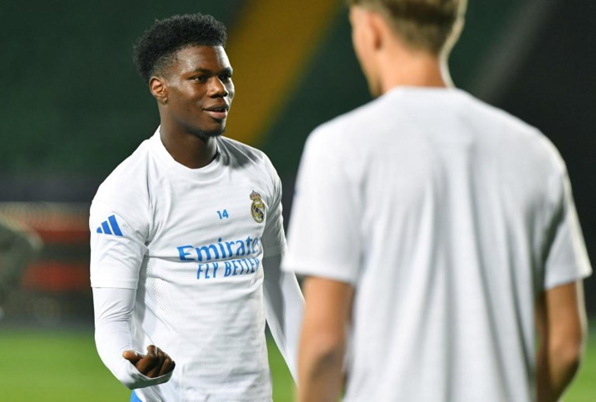 Real Madrid's French midfielder #14 Aurelien Tchouameni (L) takes part in a training session on the eve of the team's UEFA Champions League first round day 2 football match between Real Madrid (ESP) and Kairat Almaty (KAZ), at Almaty Ortalyk stadion in Almaty on September 29, 2025. VYACHESLAV OSELEDKO / AFP