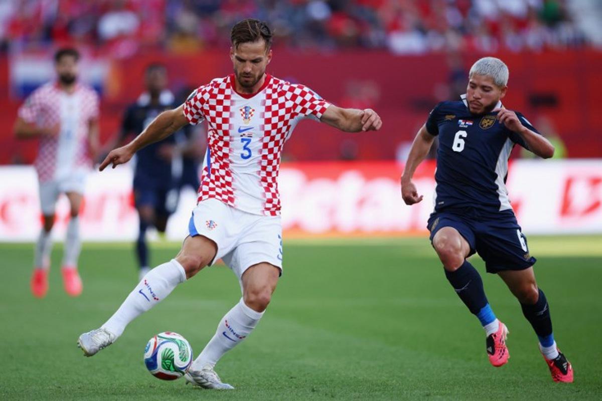 Croatia's defender #03 Marin Pongracic and Panama's midfielder #06 Cristian Martinez fight for the ball during the 2026 World Cup Group L football match between Panama and Croatia at the Toronto Stadium in Toronto on June 23, 2026. Cole Burston / AFP