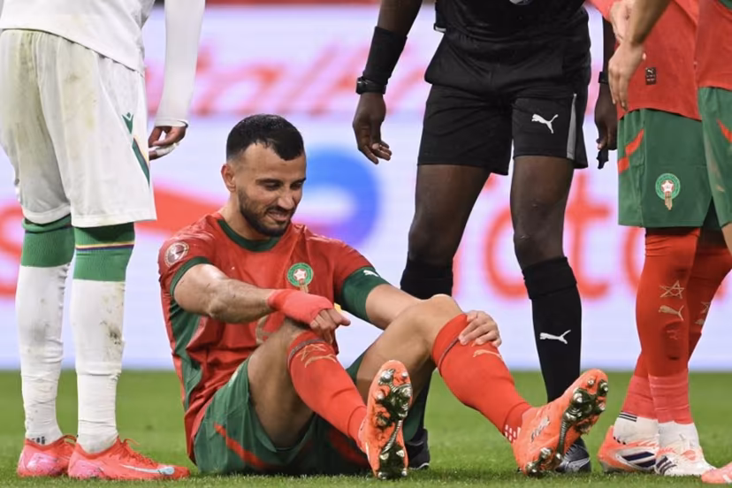 Morocco's defender #06 Romain Ghanem Saiss grimaces during the Africa Cup of Nations (CAN) group A football match between Morocco and Comoros at Prince Moulay Abdellah Stadium in Rabat on December 21, 2025. SEBASTIEN BOZON / AFP