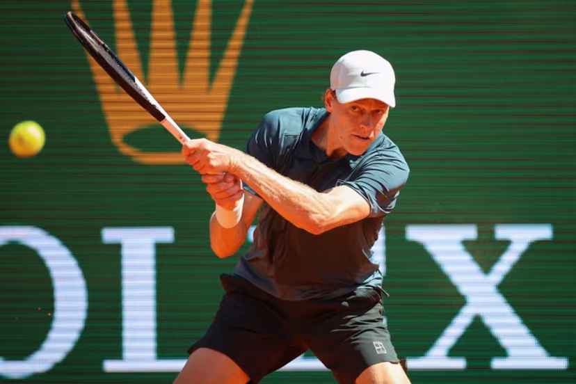 Italy's Jannik Sinner plays a backhand return to Czech Republic's Tomas Machac during their Monte Carlo ATP Masters Series Tournament round of 16 tennis match on Court Rainier III at the Monte-Carlo Country Club in Roquebrune-Cap-Martin, south-eastern France on April 9, 2026. Valery HACHE / AFP