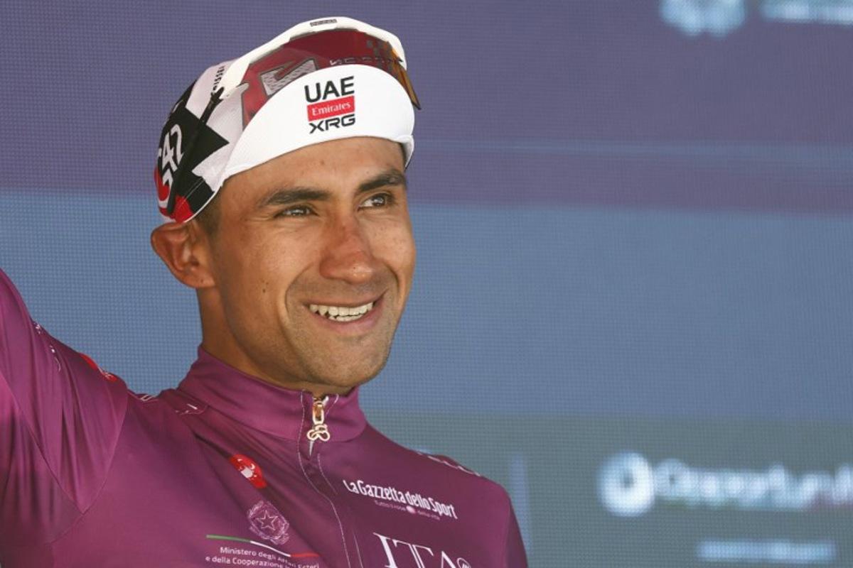 UAE Team Emirates - XRG Ecuadorian rider Jhonatan Narvaez poses with the best sprinter's cyclamen jersey on the podium of the 14th stage of the Giro d'Italia 2026 - Tour of Italy cycling race between Aosta and Pila (Gressan), Italy, on May 23, 2026. Luca Bettini / AFP