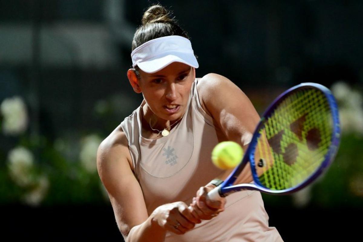 Belgium's Elise Mertens plays a backhand return to US' Jessica Pegula during their women's single match at the WTA Rome Open tennis tournament at Foro Italico in Rome, on May 10, 2025. Marco BERTORELLO / AFP