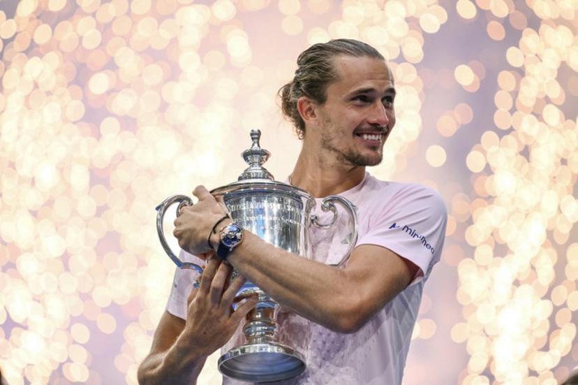Germany's Alexander Zverev hugs the trophy after defeating USA's Ben Shelton in the men's singles final tennis match on day fifteen of the US Open tennis tournament at the USTA Billie Jean King National Tennis Center in New York on September 13, 2026. ANGELA WEISS / AFP
