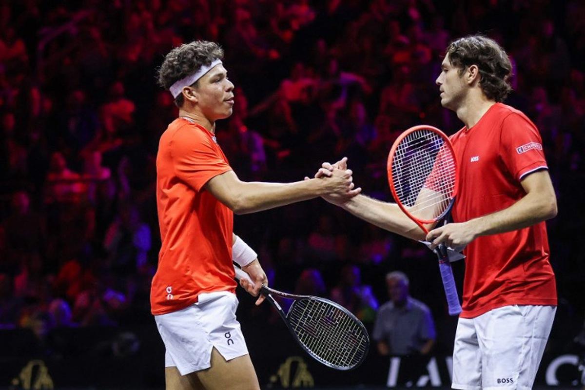 US's Taylor Fritz (R) and US's Ben Shelton (L) of Team World celebrate during their 2024 Laver Cup men's doubles tennis match against Germany's Alexander Zverev and Spain's Carlos Alcaraz of Team Europe, in Berlin, on September 20, 2024. Ronny Hartmann / AFP