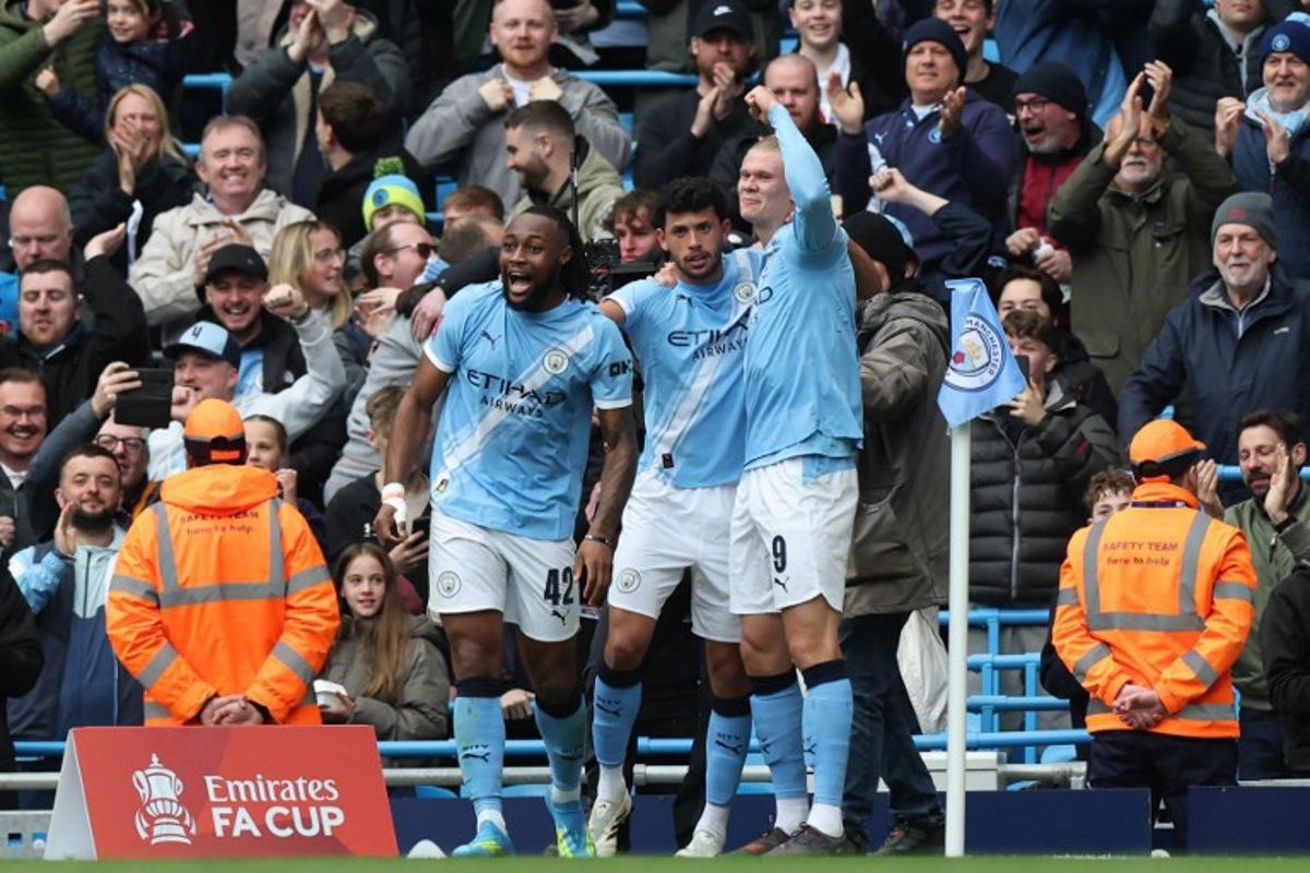 Manchester City's Norwegian striker #09 Erling Haaland (R) celebrates with teammates after scoring their second goal during the English FA Cup quarter final football match between Manchester City and Liverpool at the Etihad Stadium in Manchester, north west England, on April 4, 2026. Darren Staples / AFP