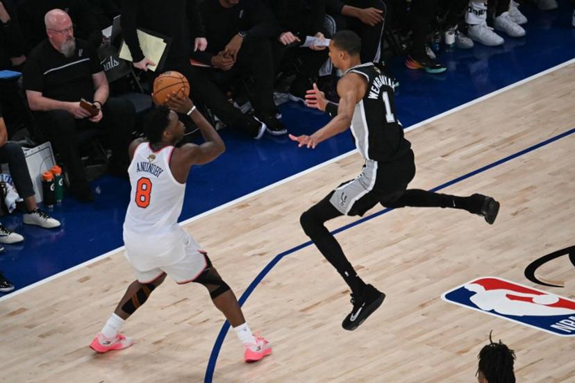 San Antonio Spurs' French forward-center #01 Victor Wembanyama jumps as Nicks' British-US player #08 OG Anunoby prepares to throw during Game Three of the NBA Finals between the San Antonio Spurs and the New York Knicks at Madison Square Garden in New York on June 8, 2026. SAUL LOEB / AFP