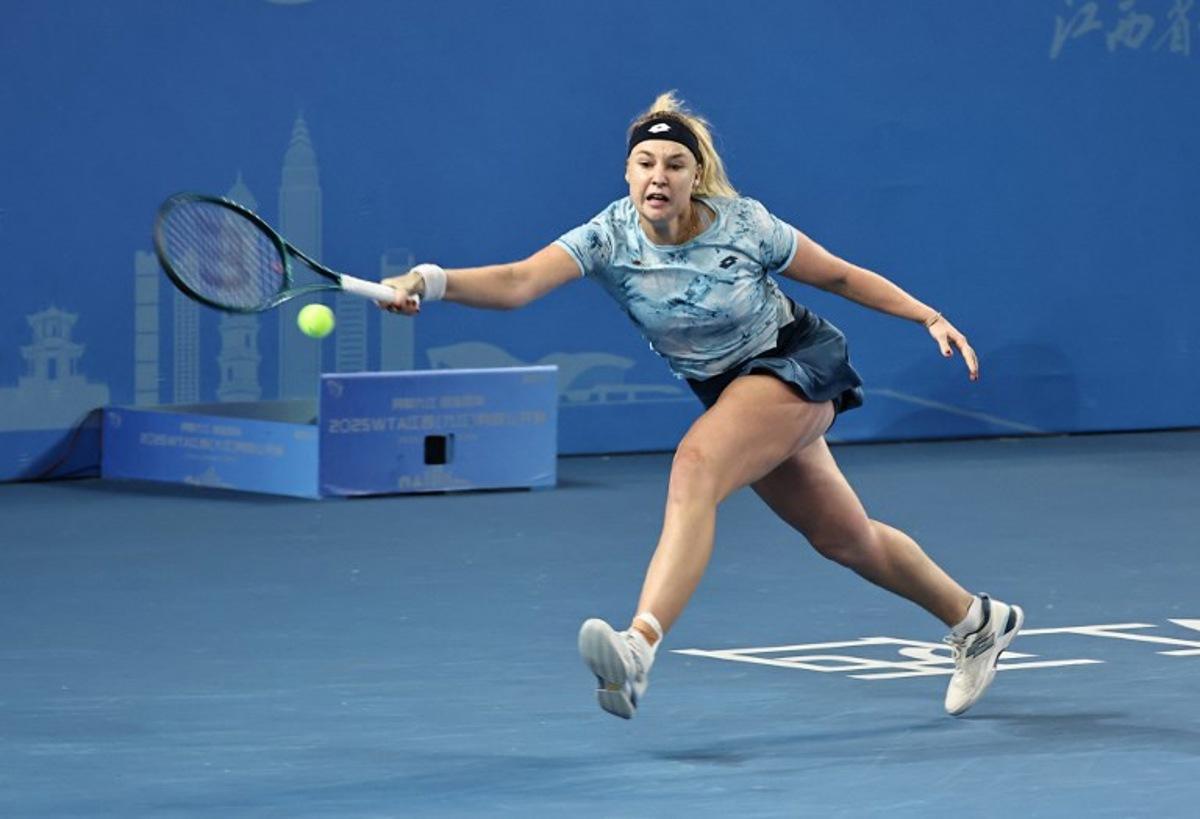 Russia's Anna Blinkova hits a return to USA's Alycia Parks during their women's singles quarterfinal match at the Jiangxi Open tennis tournament in Jiujiang, central China's Jiangxi province on October 31, 2025. STR / AFP