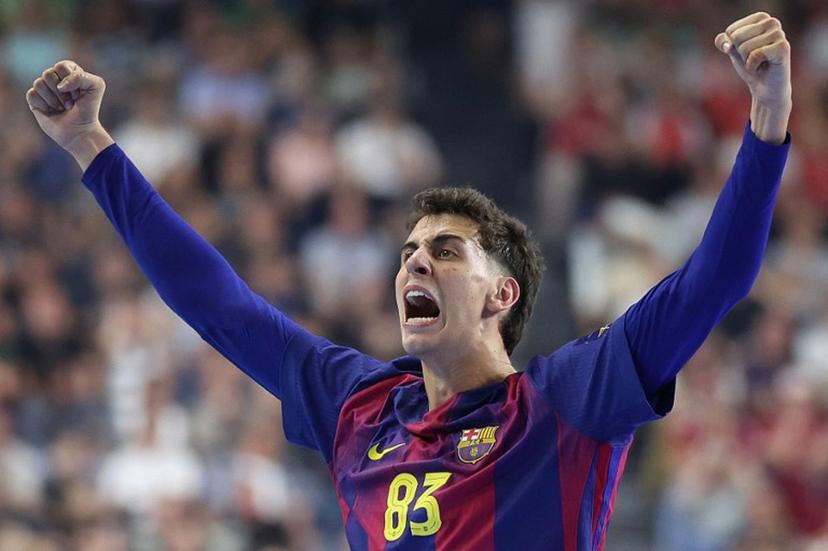 FC Barcelona's Spanish left wing #83 Ian Barrufet celebrates during the EHF Men's Handball Champions League Final 4 final between Barca and Fuechse Berlin in Cologne, western Germany on June 14, 2026. Ronny HARTMANN / AFP