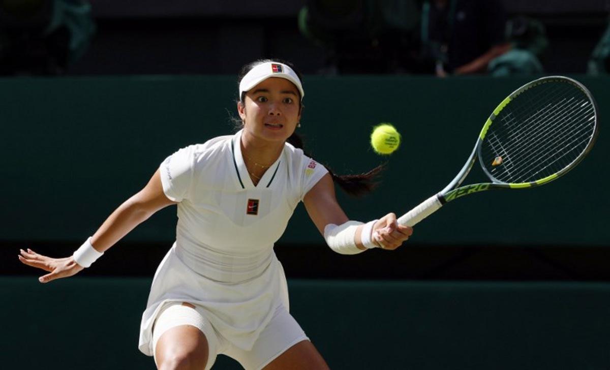 Philippines' Alexandra Eala returns to Italy's Jasmine Paolini during their women's singles round of 16 tennis match on the eighth day of the 2026 Wimbledon Championships at The All England Lawn Tennis and Croquet Club in Wimbledon, southwest London, on July 6, 2026. Adrian Dennis / AFP