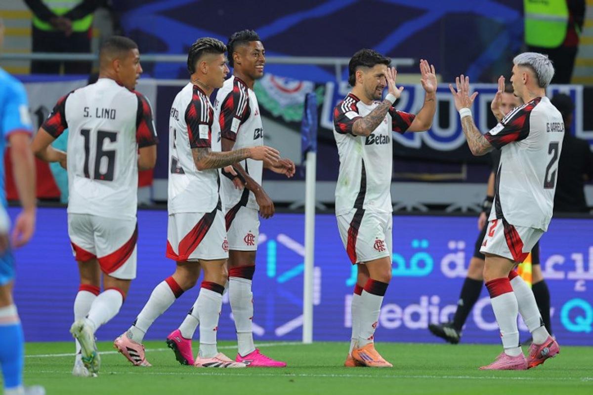 Flamengo's Giorgian de Arrascaeta #10 (2nd R) celebrates with teammates after scoring his team's first goal during the FIFA Derby of the Americas match between Cruz Azul and Flamengo at Ahmad Bin Ali Stadium in Doha on December 10, 2025. Karim JAAFAR / AFP