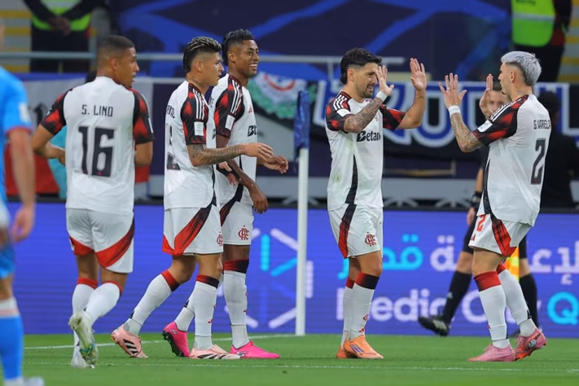 Flamengo's Giorgian de Arrascaeta #10 (2nd R) celebrates with teammates after scoring his team's first goal during the FIFA Derby of the Americas match between Cruz Azul and Flamengo at Ahmad Bin Ali Stadium in Doha on December 10, 2025. Karim JAAFAR / AFP