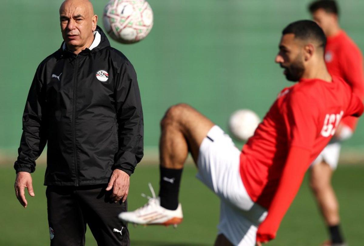 Egypt's head coach Hossam Hassan (L) and Egypt's forward #10 Mohamed Salah attend a training session at the Stadium in Taghzout, Morocco, on December 25, 2025, on the eve of the 2025 Africa Cup of Nations (CAN) football match between Egypt and South Africa. FRANCK FIFE / AFP