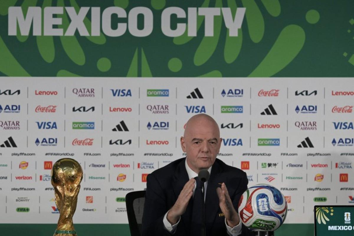 FIFA President Gianni Infantino gives a press conference with the World Cup trophy on the eve of the opening match of the 2026 World Cup football tournament at Mexico city stadium in Mexico City on June 10, 2026. Alfredo ESTRELLA / AFP