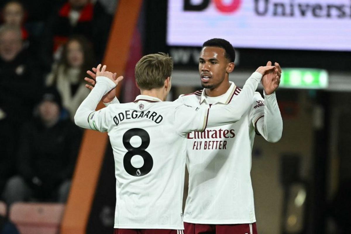 Arsenal's Brazilian defender #06 Gabriel Magalhaes (R) celebrates scoring their first goal to equalise 1-1 during the English Premier League football match between Bournemouth and Arsenal at the Vitality Stadium in Bournemouth, southern England on January 3, 2026. JUSTIN TALLIS / AFP