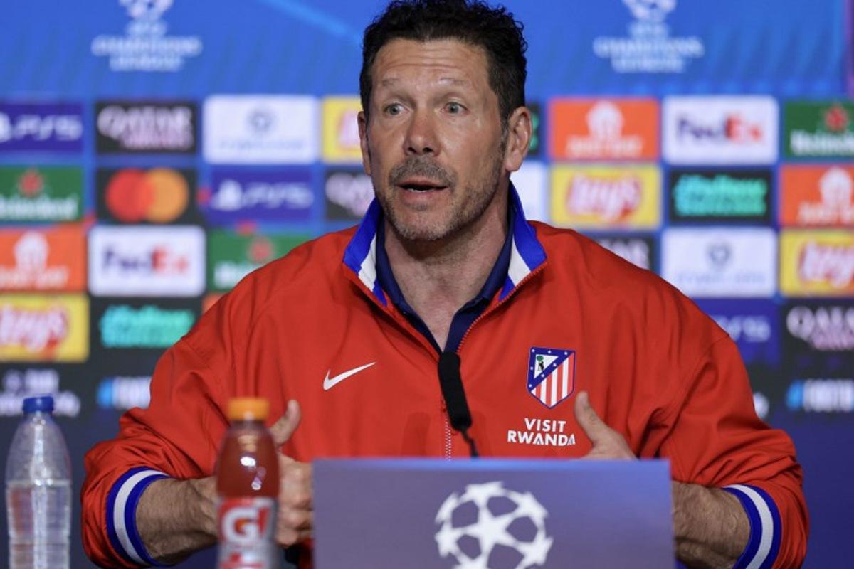 Atletico Madrid's Argentine coach Diego Simeone gives a press conference on the eve of their UEFA Champions League knockout round play-off second leg football match against Club Brugge KV at the Metropolitano Stadium in Madrid on February 23, 2026. Thomas COEX / AFP