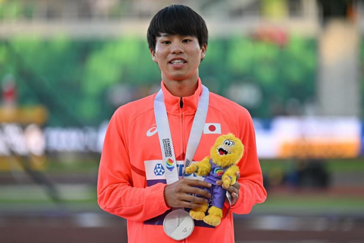 Silver medallist Japan's Koki Ikeda poses on the podium during the medal ceremony for the men's 20km race walk during the World Athletics Championships in Eugene, Oregon on July 15, 2022. ANDREJ ISAKOVIC / AFP