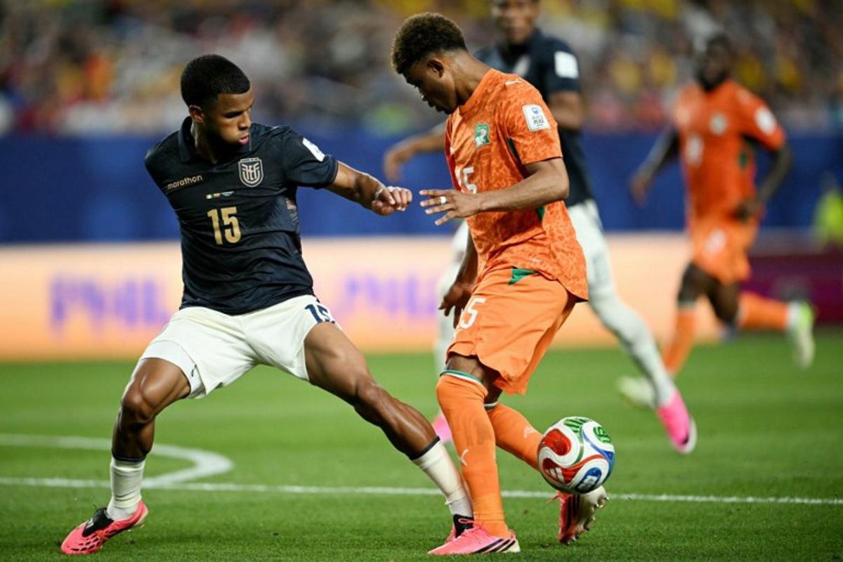 Ecuador's midfielder #15 Pedro Vite (L) and Ivory Coast's forward #15 Amad Diallo (R) fight for the ball during the 2026 World Cup Group E football match between Ivory Coast and Ecuador at the Philadelphia Stadium in Philadelphia on June 14, 2026. MAURO PIMENTEL / AFP