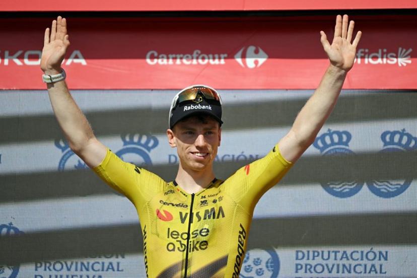 Team Visma-Lease a bike's British rider Matthew Brennan celebrates on the podium after winning the 16th stage of the Vuelta a Espana 2026 cycling tour, a 181,1 km race between Cortegana and the Monastery of Santa Maria de la Rabida in Palos de la Frontera, on September 8, 2026. JORGE GUERRERO / AFP